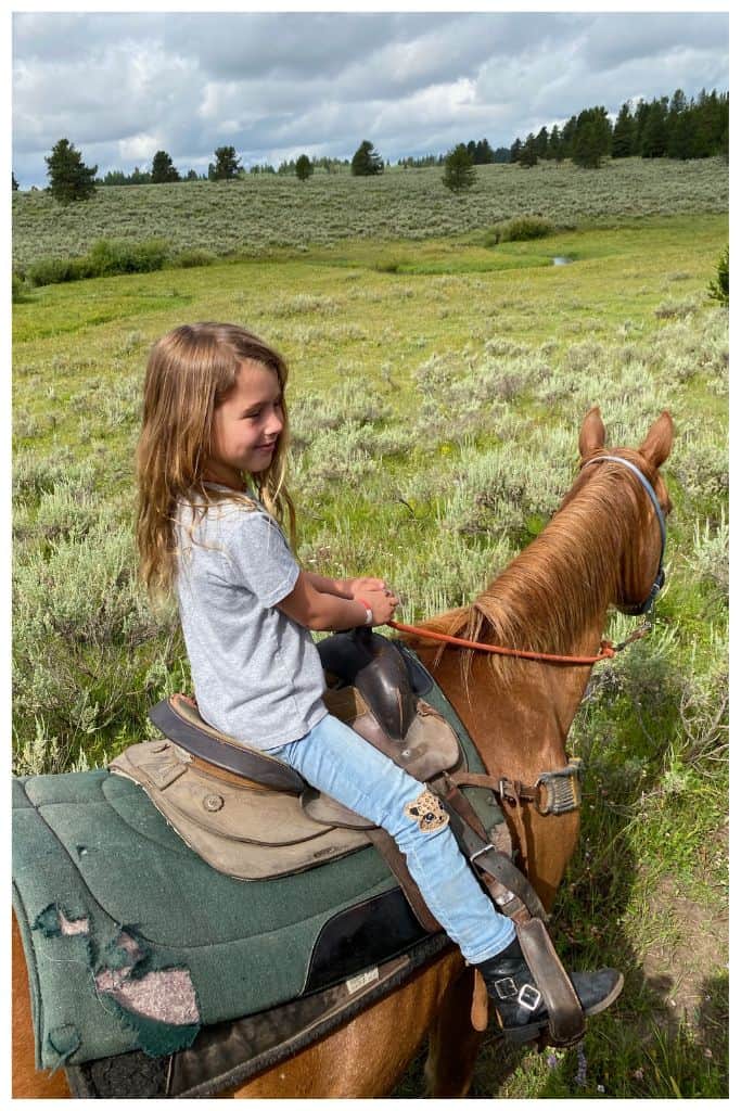 One appeal of camping is it offers numerous opportunities to try new things, such as horseback riding. 