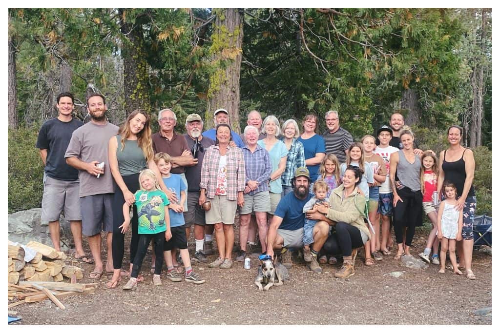 Group photo of an extended family camping trip.  The ability to connect with friends and family is a large appeal of camping