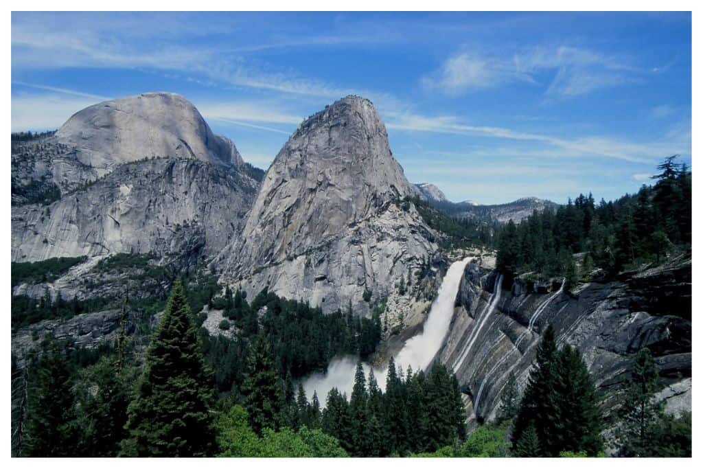 Photo of Half Dome and water fall, one of the many things Yosemite is known for. 